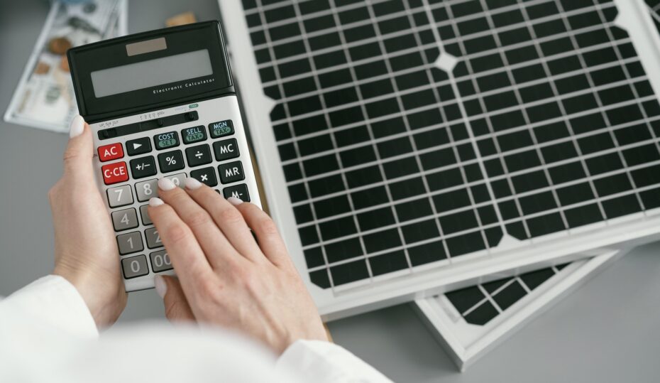 close-up-hand-typing-calculator